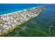 Panoramic aerial shot of waterfront homes near the ocean, blending community living with coastal beauty at 4093 Pelican Shores Cir, Englewood, FL 34223