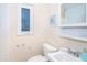 Bathroom featuring a vanity, toilet, and window. Interior of home in need of repair at 4093 Pelican Shores Cir, Englewood, FL 34223
