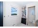 Bathroom with window view and in need of repair from previous flooding damage at 4093 Pelican Shores Cir, Englewood, FL 34223