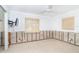 Light-filled bedroom with two windows, ceiling fan and neutral walls ready for restoration at 4093 Pelican Shores Cir, Englewood, FL 34223
