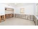 Bright bedroom features natural light from the window, closet and cement foundation ready for remodel at 4093 Pelican Shores Cir, Englewood, FL 34223