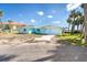 Charming light blue single story home with an attached garage and a spacious front yard, ready for personalization at 4093 Pelican Shores Cir, Englewood, FL 34223