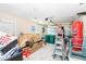 Functional garage with tools, equipment and a punching bag for convenience at 4093 Pelican Shores Cir, Englewood, FL 34223
