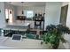 Bright kitchen featuring a large island with seating, modern appliances, and sleek white cabinetry at 4093 Pelican Shores Cir, Englewood, FL 34223