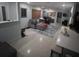 Bright living room featuring a sectional sofa, area rug, and neutral wall color at 4093 Pelican Shores Cir, Englewood, FL 34223