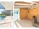 Back patio sitting area for relaxation near the pool and canal front views at 4093 Pelican Shores Cir, Englewood, FL 34223