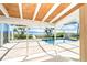 Enjoy the outdoors with a private pool, deck, and a glimpse of the serene water views at 4093 Pelican Shores Cir, Englewood, FL 34223
