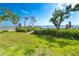 Landscaped yard leading to a waterfront dock provides a serene and private access to the water at 4093 Pelican Shores Cir, Englewood, FL 34223