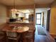 Dining area adjacent to the kitchen with a view to the kitchen and lanai at 4260 Placida Rd # 21C, Englewood, FL 34224