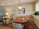 Cozy dining area adjacent to the kitchen and living room, with a comfortable seating arrangement at 4260 Placida Rd # 21C, Englewood, FL 34224