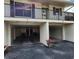 Covered condo parking with room for cars and storage, decorated with flowers at 4260 Placida Rd # 21C, Englewood, FL 34224