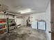 The spacious garage includes laundry hookups and ample storage shelving at 4260 Placida Rd # 21C, Englewood, FL 34224