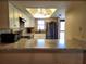 Bright kitchen with stainless steel refrigerator, white cabinets, and modern appliances at 4260 Placida Rd # 21C, Englewood, FL 34224