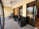 Enclosed lanai featuring comfortable seating with view to the living area at 4260 Placida Rd # 21C, Englewood, FL 34224