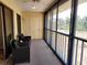 Relaxing enclosed lanai with cushioned seating and a lovely view at 4260 Placida Rd # 21C, Englewood, FL 34224