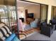 Relax on the lanai with a view of the living room at 4260 Placida Rd # 21C, Englewood, FL 34224