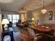 Inviting living room with comfortable seating, a ceiling fan, and access to the lanai at 4260 Placida Rd # 21C, Englewood, FL 34224