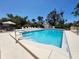 Community pool with in-water steps and several lounge chairs surrounding pool at 4260 Placida Rd # 21C, Englewood, FL 34224