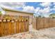 Backyard features a wooden fence adorned with potted plants, and a gravel area at 5250 Callaway St, Port Charlotte, FL 33981