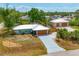 Charming single-Gathering home with a well-manicured lawn and a long driveway leading to an attached garage at 5250 Callaway St, Port Charlotte, FL 33981