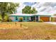 Charming single-Gathering home features a well-manicured lawn with xeriscape landscaping and attached garage at 5250 Callaway St, Port Charlotte, FL 33981