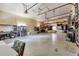 Spacious garage interior is well-lit with room for storage, a refrigerator, shelving, and a work area at 5250 Callaway St, Port Charlotte, FL 33981