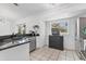 Bright kitchen featuring stainless steel appliances, sleek countertops, and ample cabinet space at 5250 Callaway St, Port Charlotte, FL 33981
