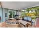 Relaxing screened-in patio area furnished with comfortable seating, perfect for outdoor enjoyment at 5250 Callaway St, Port Charlotte, FL 33981