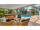 Inviting screened-in pool area with a hot tub, ideal for recreation and relaxation at 5250 Callaway St, Port Charlotte, FL 33981