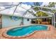 The screened lanai includes a beautiful pool, brick patio, and an outdoor dining area at 5250 Callaway St, Port Charlotte, FL 33981