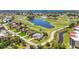 Beautiful aerial view of a golf course community, with a tranquil lake and lush landscaping at 585 Coral Creek Dr, Placida, FL 33946