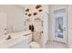Stylish bathroom with elegant decor and a glass door leading to the patio at 585 Coral Creek Dr, Placida, FL 33946