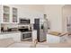 Functional kitchen with stainless steel appliances and ample cabinet space at 585 Coral Creek Dr, Placida, FL 33946