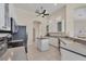 Bright kitchen with white cabinets, an island and views of the lanai at 585 Coral Creek Dr, Placida, FL 33946