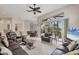 Expansive living room with seating, sliding doors, and a breakfast nook in the background at 585 Coral Creek Dr, Placida, FL 33946
