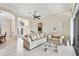 Spacious living room offers tile floors and an archway to the formal dining room at 585 Coral Creek Dr, Placida, FL 33946