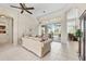 Cozy living room features tile flooring and sliding glass doors with access to a lanai at 585 Coral Creek Dr, Placida, FL 33946