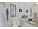 Bright bathroom features a marble countertop with a decorative glass sink at 5879 Venisota Rd, Venice, FL 34293