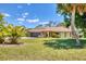 Charming single-story home with a well-manicured lawn and tasteful landscaping at 5879 Venisota Rd, Venice, FL 34293