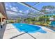 Stunning screened-in pool with clear blue water, perfect for relaxation and outdoor enjoyment at 5879 Venisota Rd, Venice, FL 34293