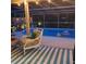 Relaxing screened pool area features comfortable seating and stylish decor for enjoying the outdoors at 5879 Venisota Rd, Venice, FL 34293