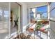 Cozy balcony featuring patio chairs and a view of the surroundings at 708 Tamiami S Trl # 216, Venice, FL 34285