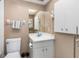 Functional bathroom space with a white vanity and neutral wall tones at 708 Tamiami S Trl # 216, Venice, FL 34285