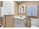 Modest bathroom featuring a white cabinet and standard fixtures at 708 Tamiami S Trl # 216, Venice, FL 34285
