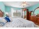 A quaint bedroom boasts traditional furniture and a window view at 708 Tamiami S Trl # 216, Venice, FL 34285