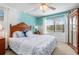 Comfortable bedroom featuring light turquoise walls and coordinating furniture at 708 Tamiami S Trl # 216, Venice, FL 34285