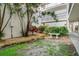 Picturesque courtyard surrounded by lush greenery and attractive building architecture at 708 Tamiami S Trl # 216, Venice, FL 34285