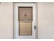 Front door featuring screen, peephole and knocker at unit 216 at 708 Tamiami S Trl # 216, Venice, FL 34285