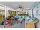Inviting outdoor patio area featuring comfortable seating and tropical decor at 708 Tamiami S Trl # 216, Venice, FL 34285