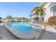 Community pool offering a refreshing escape on a sunny day at 708 Tamiami S Trl # 216, Venice, FL 34285
